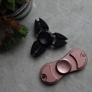 Two fidget spinners